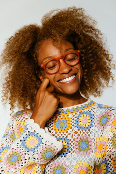 Cheerful woman with glasses smiling
