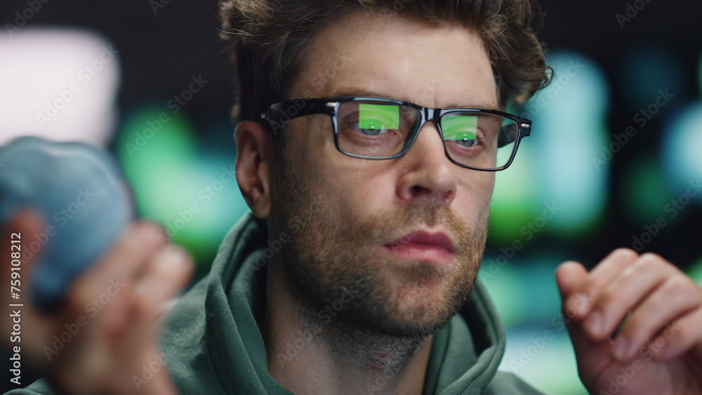 Poster serious computer scientist working in data center closeup. it man holding ball