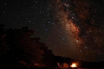 A campfire crackles nearby, casting a warm glow on a tent and camping chairs. 
