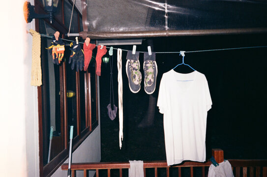 Drying clothes on hangers . Terrace of tropical house.
