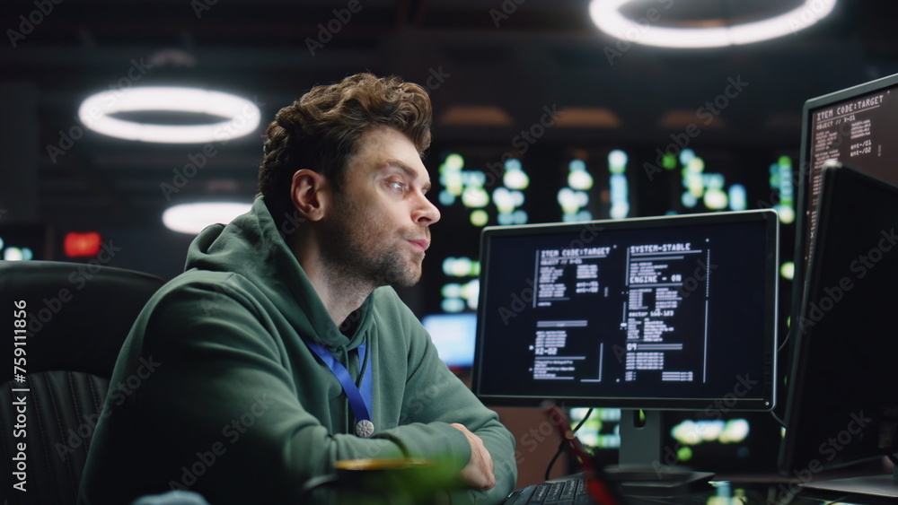 Poster overworked programer looking monitor working late in office closeup. man typing