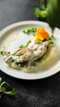 frog legs meat in cream sauce gourmet cooking eating cooking appetizer meal food snack on the table copy space food background rustic top view