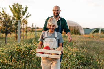 Gardeners walking in field