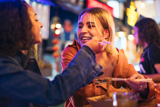 Lesbian couple having a date at a street market