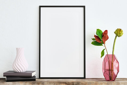Mock up poster frame on white plaster wall with artichoke with leaves, books and geometric object on old wooden table; portrait orientation; stylish frame mock up; 3d rendering, 3d illustration