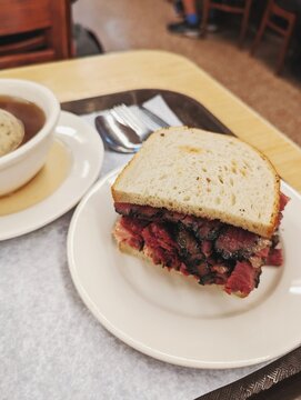 Pastrami sandwich and matzoh ball soup 