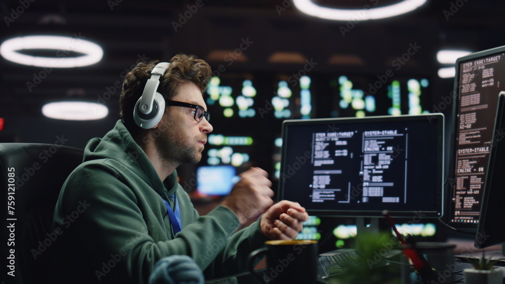 Poster it programer listening headphones working desktop computer data center closeup