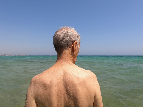 UGC Senior man with wet skin observing the Mediterranean sea