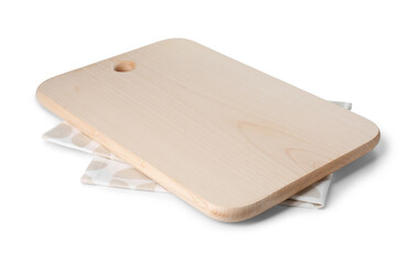 Wooden cutting board and kitchen towel on white background