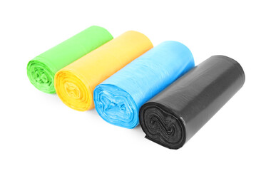 Rolls of colorful garbage bags isolated on white
