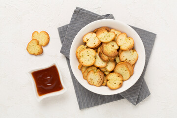 Spiced bruschette chips on concrete background, top view