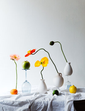 beautifully decorated table with vibrant flower-filled vases