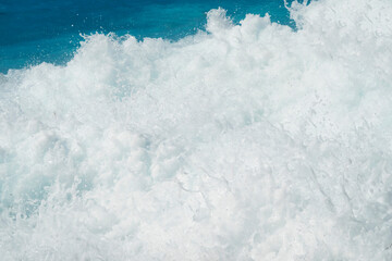 Amazing turquoise sea water and wave splash foam