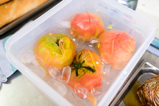 Tomatoes on ice ready to peel
