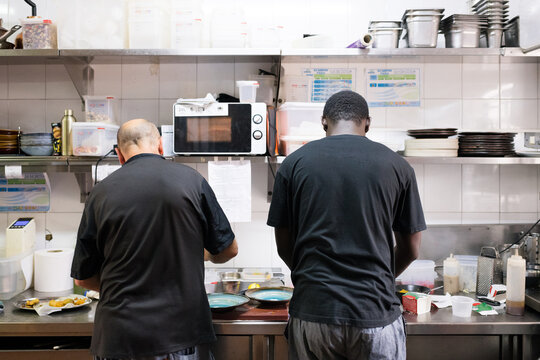 Diverse chefs working in restaurant kitchen