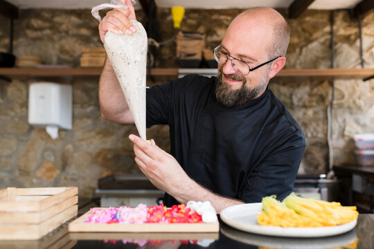 Chef enjoying creative cooking process