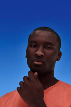 Young African American man in deep thought.