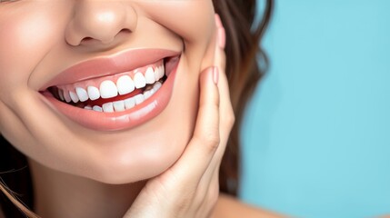 Obraz premium Beautiful white teeth and smiling face of a female