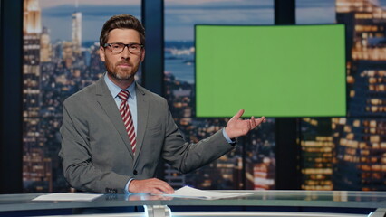 Professional television presenter ending evening newscast standing modern studio