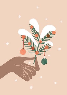winter modern  background with hand holding christmas fir branch