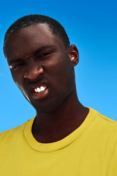 Afro-American man with a disgusted expression.