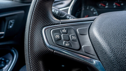 cruise control buttons on the steering wheel in a new car