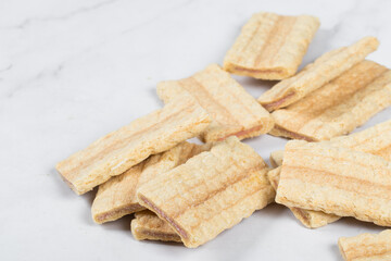 Corn oat rice bars strips with fruit and berry filling. Close-up. White background