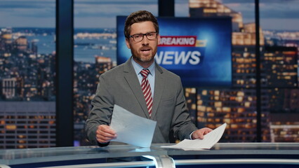 Man newsreader reporting live program at newscast multimedia channel closeup