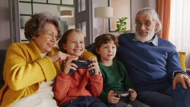 Grey haired woman and man spending weekend with grandkids