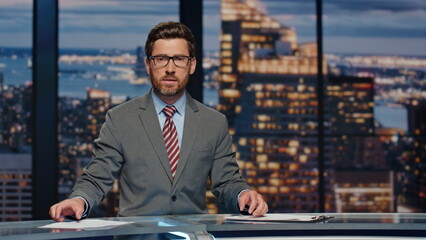Serious newsreader speaking newscast evening studio closeup. Man broadcasting 