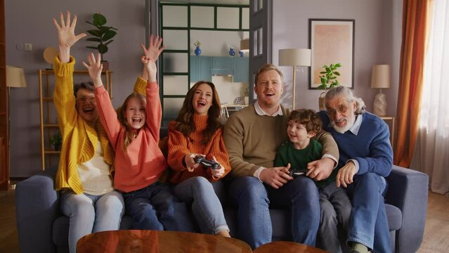 Family completing playing interactive online game on tv