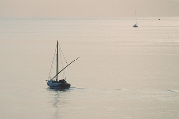 fishing boat in the sea, Barca di Pescatori in mare al tramonto.Alghero. Sardegna....
