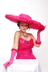 woman in big fashion pink hat