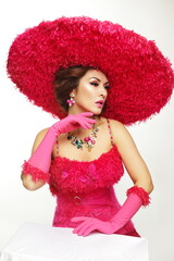 woman in big fashion pink hat