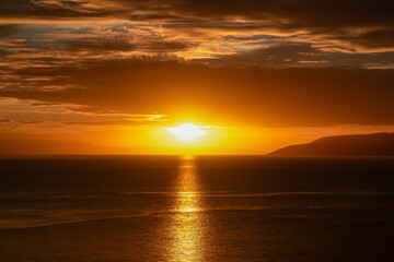 Obraz premium Aerial sunset view of Dalmatian archipelago seen from coastal town Makarska, Split-Dalmatia, Croatia, Europe. Silhouette of islands. Coastline of Makarska Riviera, Adriatic Sea. Balkans in summer