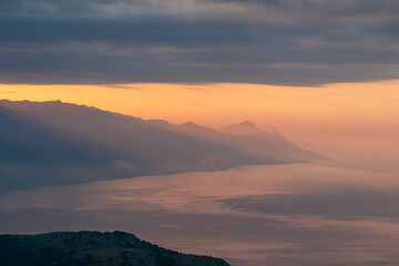 Scenic view from on top of mount Kula near Omis, Dinara mountains, Split-Dalmatia, Croatia, Europe. Majestic coastline of Makarska Riviera, Adriatic Sea in Balkans in summer. Biokovo mountain range