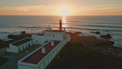 Orange marine sunset aerial view. Majestic golden sun light reflecting in ocean