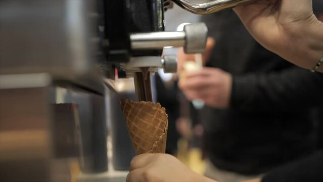 Woman makes a chocolate italian ice-cream