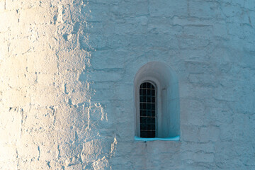 An apsis window of the Balke Medieval Stone Church, Toten, Norway. - obrazy, fototapety, plakaty