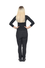 Fototapeta premium rear view of a blonde woman standing with akimbo on white background