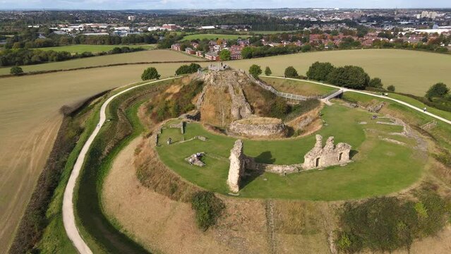 Aerial video shot of castle ruins Sandal in Wakefield UK and people relaxing and have a good time, Various recording angles