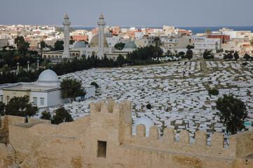 Fototapeta premium Sidi el Mezeri Muslim cemetery next to Mausoleum of Habib Bourguiba and walls of Ribat of Monastir, Tunisia