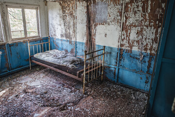 Bed in floating restaurant in Pripyat ghost city in Chernobyl Exclusion Zone in Ukraine - obrazy, fototapety, plakaty