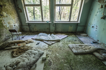 Patient room in Hospital MsCh-126 in Pripyat ghost city in Chernobyl Exclusion Zone, Ukraine - obrazy, fototapety, plakaty