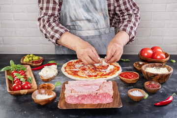 Pizza preparation with chef hands
