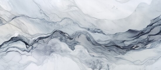 Naklejka premium A detailed shot showcasing the beautiful marble texture resembling a black and white pattern, reminiscent of snowcapped mountainous landforms in a landscape setting