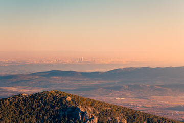 Golden sunset over Siete Picos and Madrid skyline