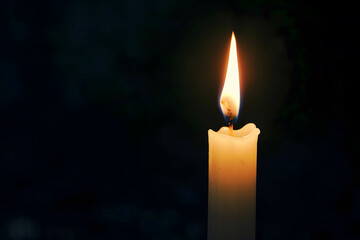 One lit candle on dark background - 759249863