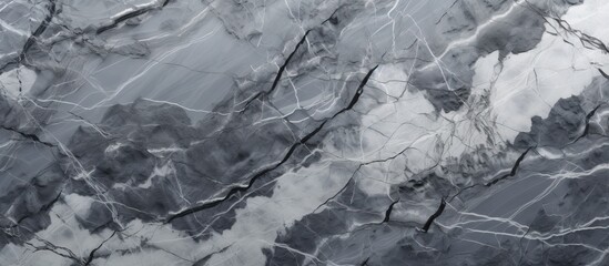 A close up of a grey and white marble texture resembling a freezing winter landscape, with a pattern of wind waves and rocks on a slope