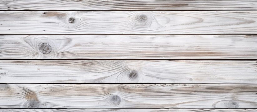 Closeup of a grey hardwood plank table with a wood stain finish, showcasing a beautiful siding pattern on the rectangular surface, set against a blurred background